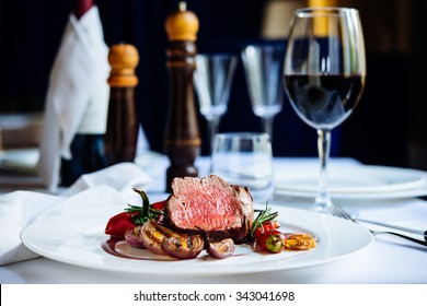 Beef Steak With Grilled Vegetables Served On White Plate