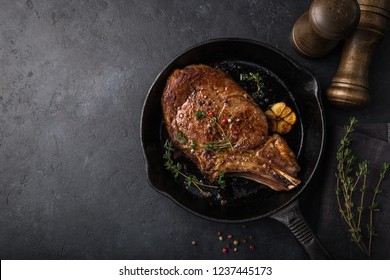 Beef Steak On Cast Iron Pan, Dark Background, Top View