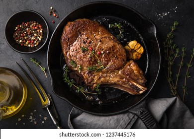 Beef Steak On Cast Iron Pan, Dark Background, Top View