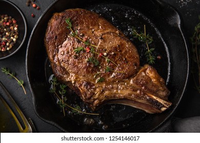 Beef Steak On Cast Iron Pan, Dark Background, Top View