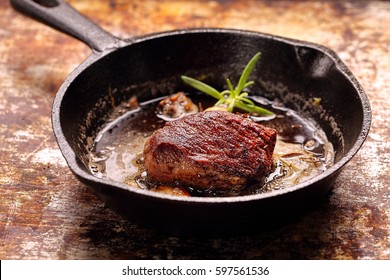 Beef steak on cast iron skillet with empty space for text