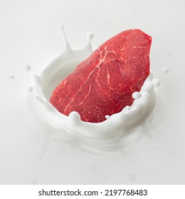 Beef Steak, Raw Meat Falls Into Milk, Yoghurt, Sour Cream, Splash