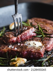 Beef Steak With Rosemary, Black Pepper, Sea Salt And Butter On A Grill Pan, Selective Focus