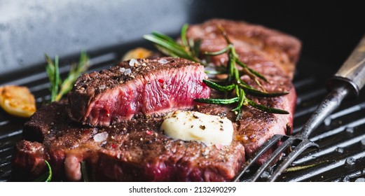 Beef Steak With Rosemary, Black Pepper, Sea Salt And Butter On A Grill Pan, Selective Focus, Banner