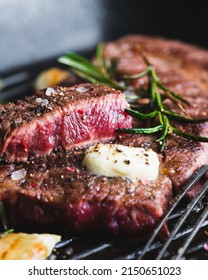 Beef Steak With Rosemary, Black Pepper, Sea Salt And Butter On A Grill Pan, Selective Focus