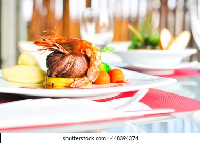 Beef Steak With Shrimp On Top Side Dish View Close.