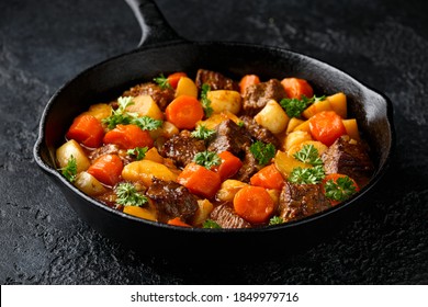 Beef Stew with carrot and baby potato in iron cast pan