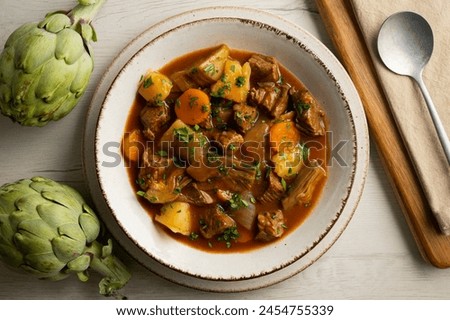 Beef stew with potatoes and artichokes.