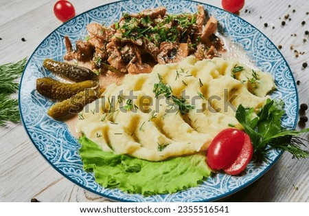 Beef stroganoff with mushroom sauce and mashed potatoes