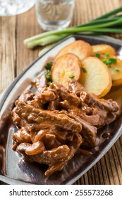 Beef Stroganoff,  Original Recipe Of Russian Dish. Thin Strips Of Beef  Cooked In Sour Cream And Tomato Paste,  Served With Crisp Potato