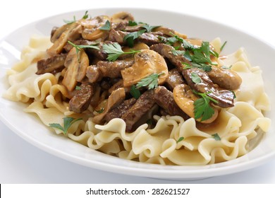 beef stroganoff with pasta, russian cuisine isolated on white background - Powered by Shutterstock