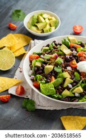 Beef Taco Salad With Romaine Lettuce, Avocado, Tomato Salsa, Black Bean And Tortilla Chips. Mexican Healthy Food