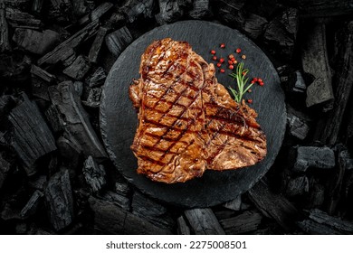 Beef T-bone steaks on BBQ grill coal. porterhouse steak or T Bone Steak. Restaurant menu, cookbook recipe. place for text, top view. - Shutterstock ID 2275008501