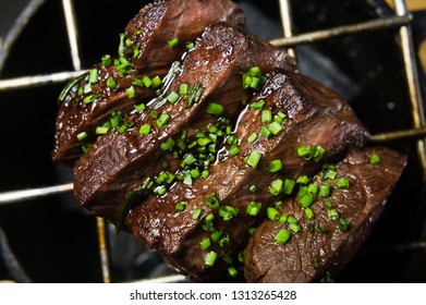 beef tenderloin grilled steak, black background, close-up - Shutterstock ID 1313265428