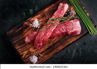 Beef Tenderloin On A Wood Board With Salt And Thyme Top View, Skirt Steak