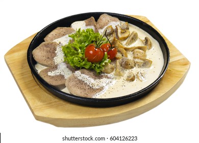 Beef tongue with mushrooms and cream sauce