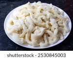 Beef tripe (bucho), beef stomach, tripe on a white plate. Dobradinha