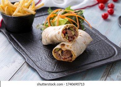 beef wrap , beef burrito beef roll, lamb wrap , lamb burrito lamb roll  on the wooden background