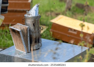 Beekeeping - smoker placed on a hive during a health inspection of an apiary by the beekeeper - Powered by Shutterstock