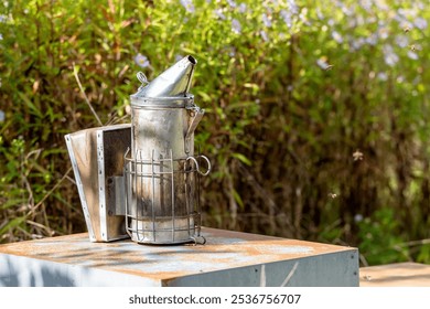 Beekeeping - smoker placed on a hive during a health inspection of an apiary by the beekeeper - Powered by Shutterstock