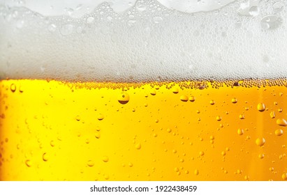 Beer background with bubble froth texture foam pouring alcohol soda in glass happy celebration party holiday new year concept object design