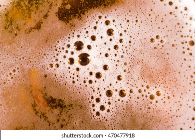 Beer Background. Foam With Bubbles Close Up.