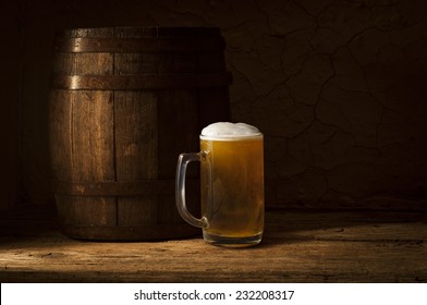 Beer Barrel With Beer Glasses On Table On Wooden Background