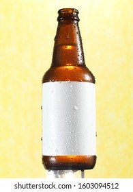 Beer Bottle With Blank White Beer Label On Yellow Backgroud Outline With Water Droplets