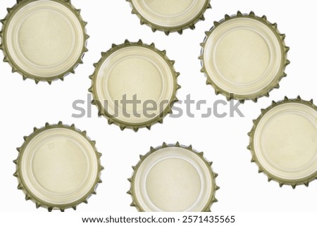 Beer bottle caps upside down on a white background