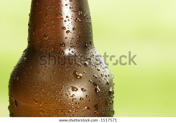 Download Beer Bottle Condensation Against Green Background Stock Photo Edit Now 1517571 PSD Mockup Templates