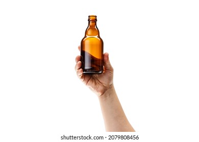 Beer bottle. Cropped image of male hand holding bottle of strong alcohol drink isolated over white background. Concept of alcohol, drink, party, degustation, holiday. Copy space for ad - Powered by Shutterstock