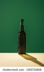 Beer Bottle With Shadow Isolated On Green, St Patrick Day Concept