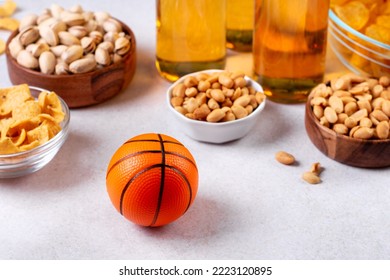 Beer In Bottle And Snack On Grey Concrete Table With Basketball Ball, Game Night Food