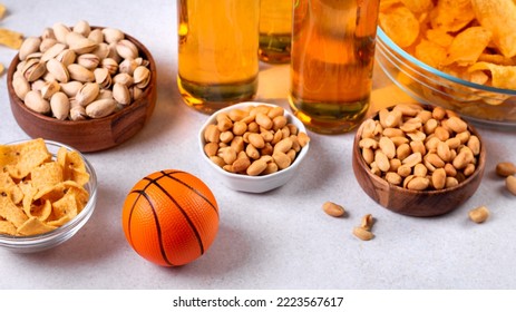 Beer In Bottle And Snack On Grey Concrete Table With Basketball Ball, Game Night Food