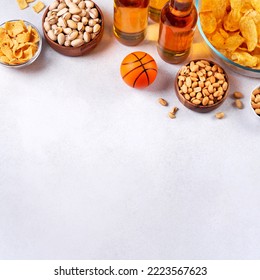 Beer In Bottle And Snack On Grey Concrete Table With Basketball Ball, Game Night Food