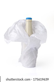 Beer Bottle Wrapped Into The Paper. (Isolated On White)