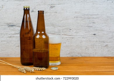 Beer Bottles And Glass On Pub Table