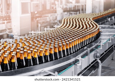 Beer bottles on conveyor production line. Banner Brewery industry food factory manufacturing. - Powered by Shutterstock