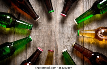 Beer Bottles On A Wooden Table . Top View