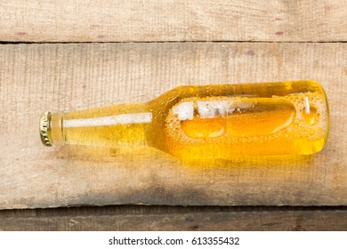 Beer Bottles On A Wooden Table .