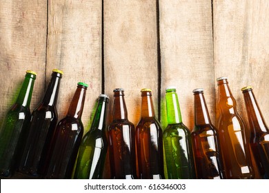 Beer Bottles On A Wooden Table .