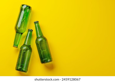 Beer bottles on yellow background. Flat lay with copy space - Powered by Shutterstock