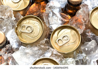 Beer Can And Bottle Chilled In Ice Top View Closeup