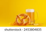 Beer, chips and pretzel. Over yellow background with copy space