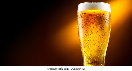 Beer. Cold Craft Light Beer In A Glass With Water Drops. Pint Of Beer Close Up Isolated On Black Color Background. Border Design.