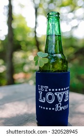 Beer In A Cooling Sleeve With Clover