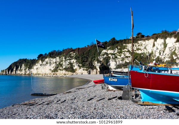 Beer\
Devon\
England\
March 31,\
2016\
Fishing boats hauled up on to the beach at the fishing\
village of\
Beer.