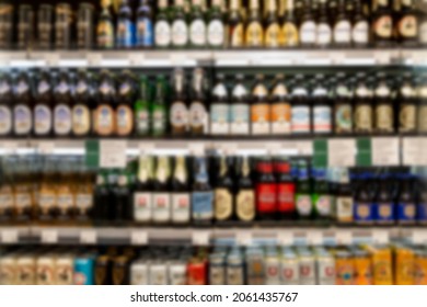 Beer Of Different Brands On The Shelves In The Store. Low Alcohol Drinks. Front View. Blurred.