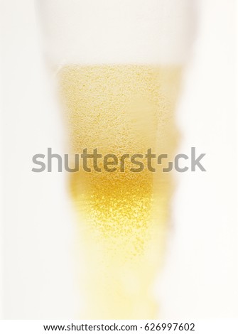 Beer glass blurred with foam crown and droplet  Stock photo © 