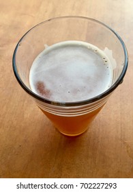 Beer In Glass Looking Down On Wood Table Angled Top View